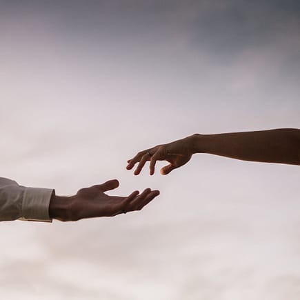 couple with hands apart