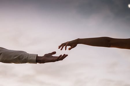 couple with hands apart